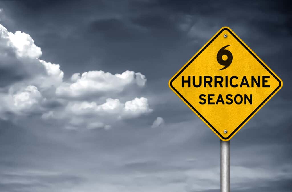 Hurricane season incoming yield sign with dark skies in the background.