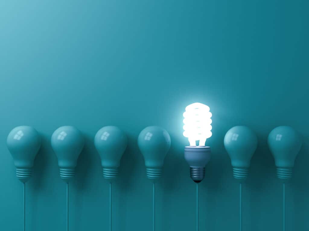 Resilient Standby Power represented with light bulbs, one hanging eco energy saving light bulb glowing.