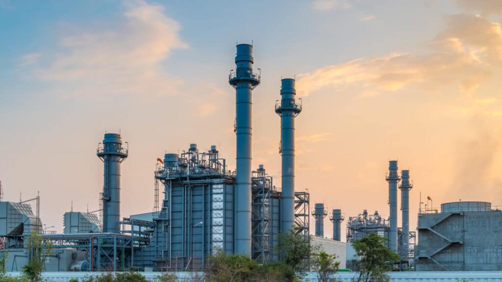 Gas turbine electrical power plant with sunset.