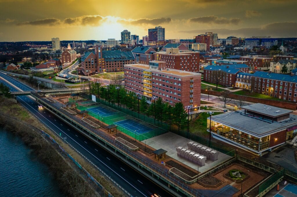 Aerial photo showing a city with a river nearby.