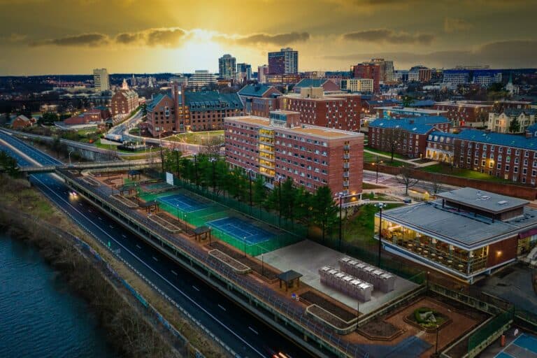 Aerial photo showing a city with a river nearby.