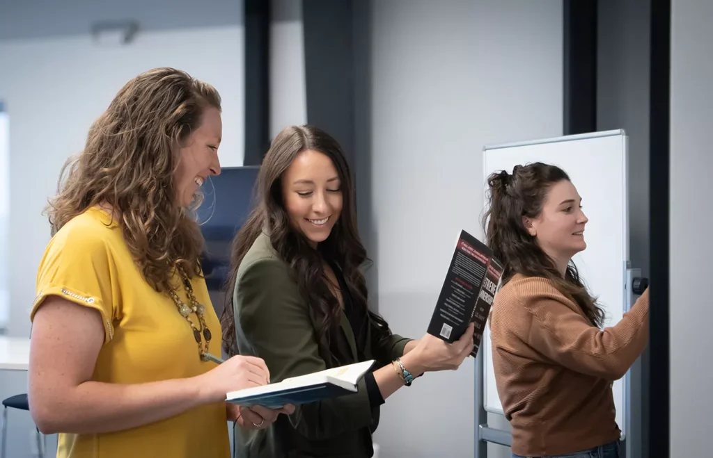 Mesa Power Solutions employees show how women in business brainstorm ideas together. Following rules and principles from leadership books like Extreme Ownership.