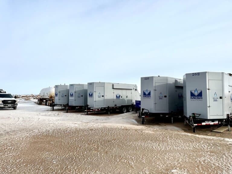 An image of 350kW natural gas generators lined up on a site with a Mesa tech truck.